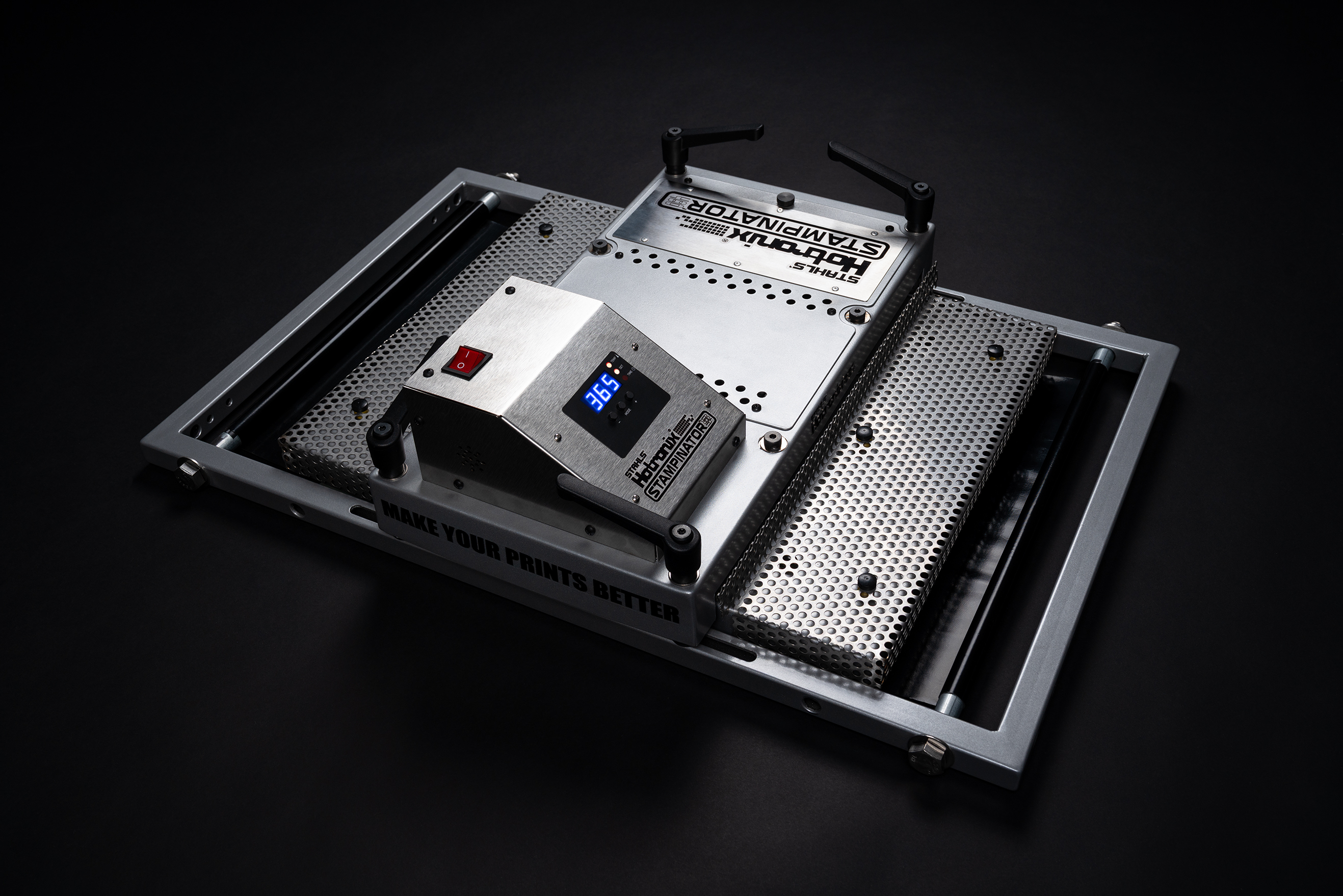 <p>Hotronix®, LLC and Stampinator® have partnered to bring the best in heat press technology to screen printers who own automatic screen printing presses and want to stay on the cutting edge of on-demand printing. Hotronix® heaters provide consistent heating throughout their cast-aluminum platens, tight manufacturing tolerances for upper platen consistency, and an industry-leading warranty.</p> <p>The Stampinator® 480 is a versatile 5-in-1 attachment designed to fit seamlessly onto automatic screen printing presses. It transforms the press into a multi-functional heat press capable of handling:<br>   -  Stamp Flashing the Underbase<br>   -  Quick Curing<br>   -  Smoothing Fibers<br>   -  In-Line Heat Transfers, including DTF<br>   -  In-Line Letters and Numbers<br>   -  Specialty Material and Premium Add-On Applications</p>
